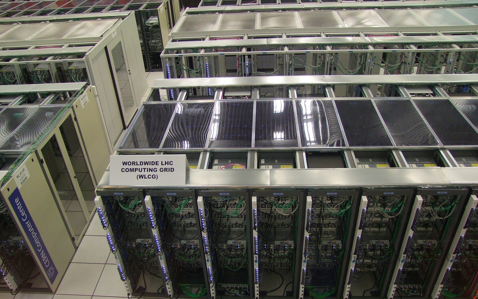 Server racks labeled Worldwide LHC Computing Grid (WLCG) inside a data centre aisle