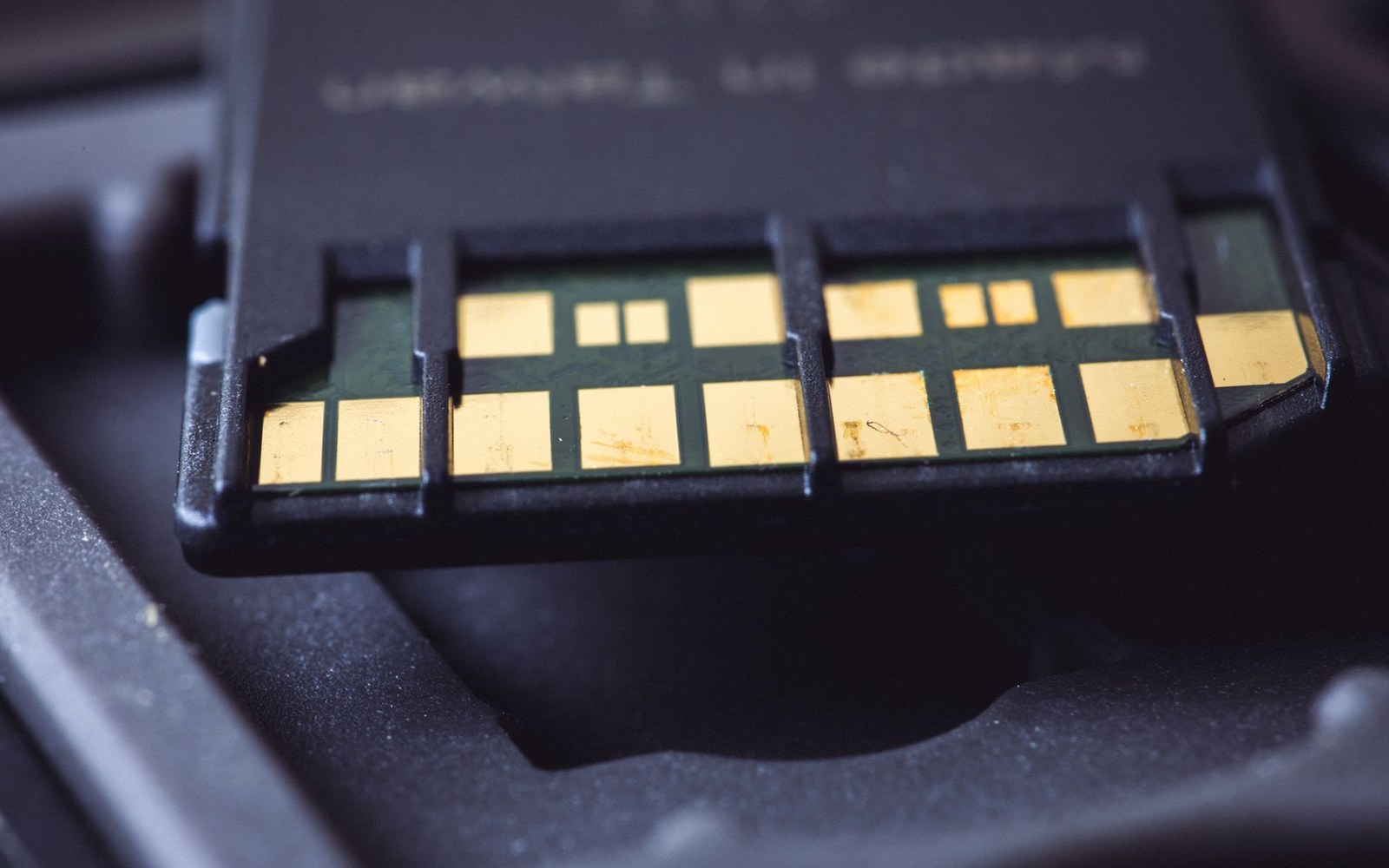 Close-up of gold contact pads on a memory card's edge connector