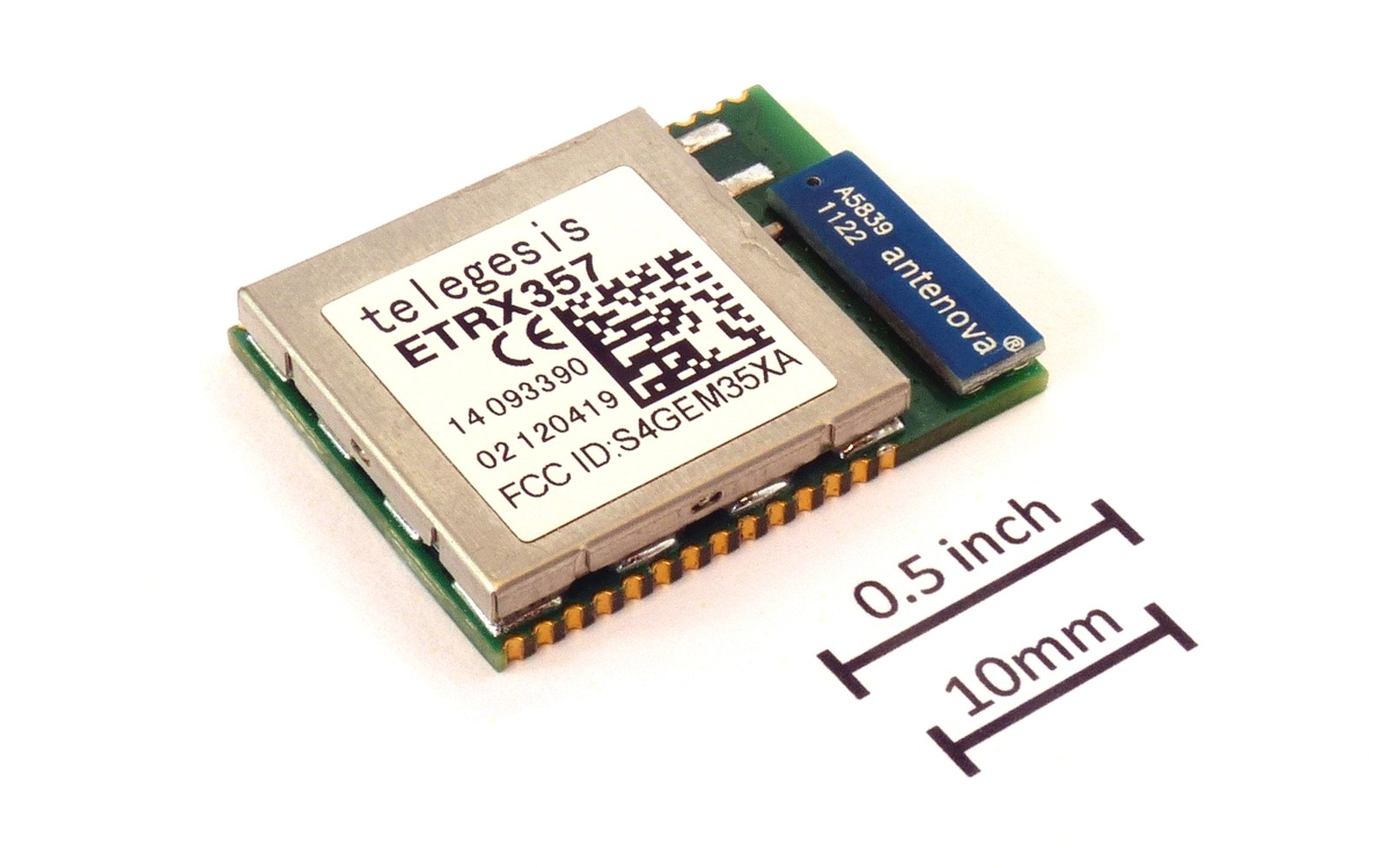 Telegesis ETRX357 wireless module with antenova antenna, shown beside a size scale